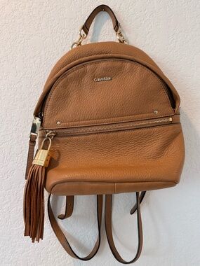 Calvin Klein Cognac Pebbled Leather Mini Backpack with Tassel